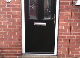 Black arched Conway 3 composite door with Royale glass installed in house in Lincoln