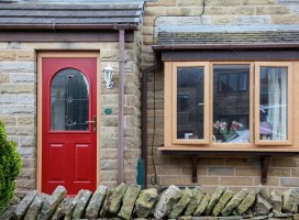 Stafford composite door in Red with Irish Oak frame and Red quad glass, Hade Edge