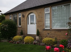 White arched Beeston composite door with integrated side panels.