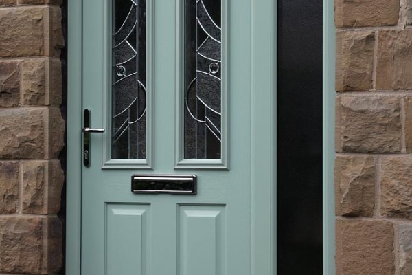Ludlow composite door in Chartwell Green with Abstract glass and integrated side panel.